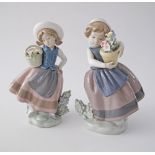 A pair of Lladro porcelain figurines depicting girls with baskets in mint condition. H17cm (2)