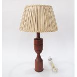 A vintage Danish turned teak table lamp, c1960s. H46cm the wood, H66cm with shade.