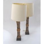 A pair of gilt bronze table lamps. Total H114cm incl. shades, H63cm the metal base. (2)