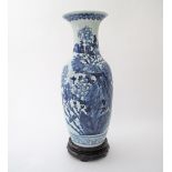A Chinese celadon ground blue and white baluster porcelain vase with phoenix and peony above