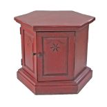 An oak red stained hexagonal cupboard. W68cm, H57cm
