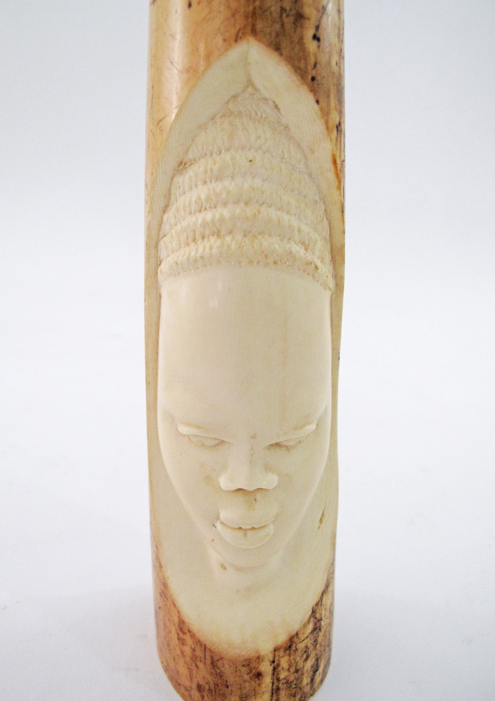 A carved African ivory tusk.