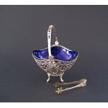 A German silver basket c19th century lined with a blue glass bowl together with a pair of silver