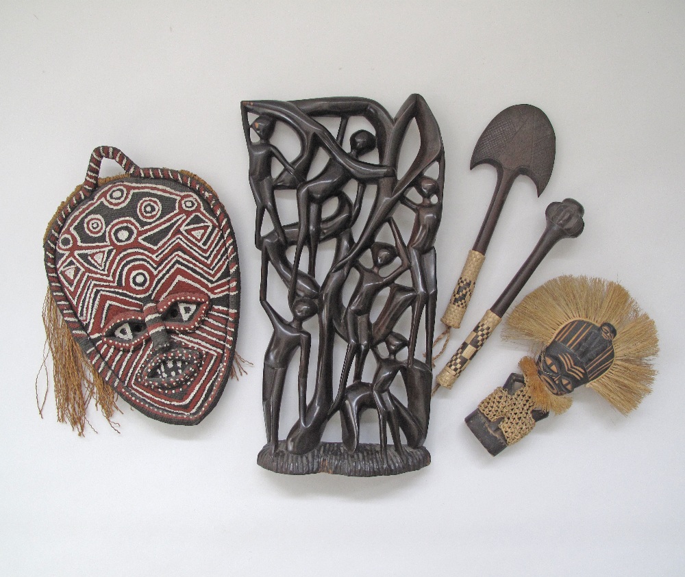 A collection of African artifacts comprising a hardwood carving H42cm, W22cm. (5)