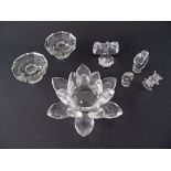 A collection of crystal decorations comprising a large star W15cm, a pair of candlesticks and