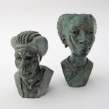 A pair of malachite African carvings H10cm and H12cm. (2)