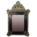 A probably Dutch repousse brass and wood beveled mirror c19th century. 78 x 52 cm.