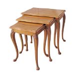 A set of three Cypriot Chippendale style nest of tables, carved and quarter veneered walnut on