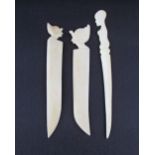 A collection of three African carved ivory paper knives, late 19th / early 20th century with