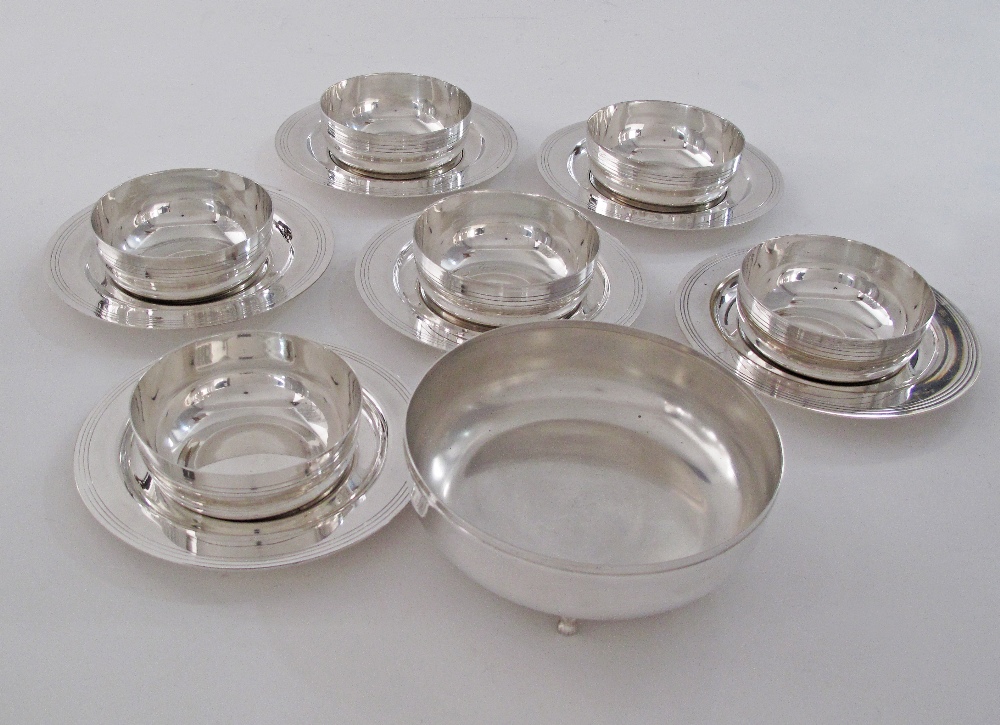 A collection of silver plated bowls W11cm with saucers W17cm, together with a larger bowl W16cm. (