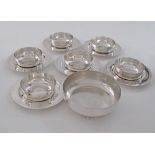 A collection of silver plated bowls W11cm with saucers W17cm, together with a larger bowl W16cm. (