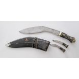 A Nepalese Kukri (Top) with the traditional Karda (middle) and Chakmak (bottom). The Karda and