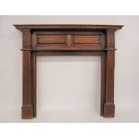 An English carved oak fire surround, Arts & Crafts period and style. H137cm, W152cm, D25cm, internal