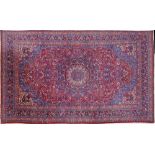 A large and fine Isfahan Persian handmade carpet, cotton / wool, with floral patterns and a