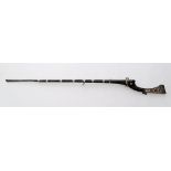 An antique Balkan Torador matchlock musket with decoratively chased silver mounts and bands, the