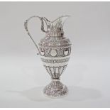 An Egyptian Hallmarked 900 silver pitcher, repousse and engraved in the Greek style, the handle with