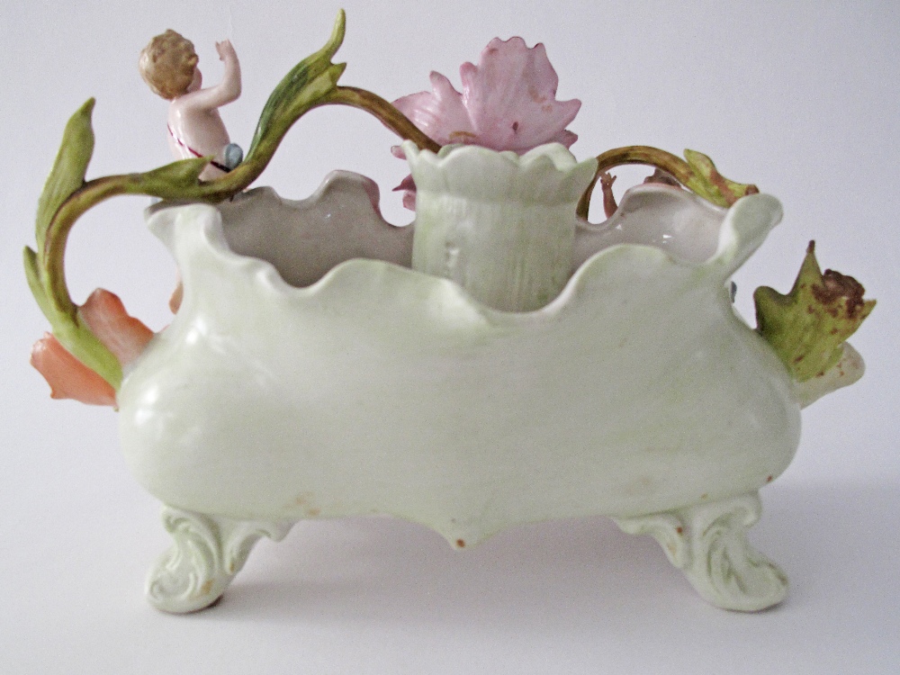 An unmarked porcelain boat probably French Samson, decorated with flowers and cherubs in relief, - Image 2 of 4