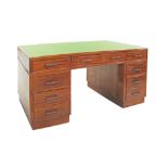 A mahogany partners' pedestal desk, mid 20th century, the leatherette green inset top containing