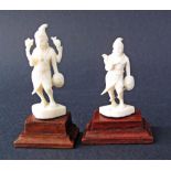 A pair of carved ivory figures, probably Vishnu one of the principal deities of Hinduism, on