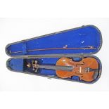 A late 19th century violin stamped Hopf with carved scroll end, cased in a wooden case with one