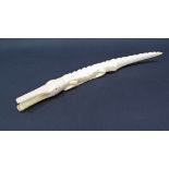 An African carved ivory crocodile, c19th / early 20th century, weight 257g, L38cm. This lot complies