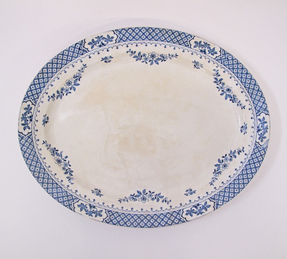 A large meat serving oval ceramic dish in blue and white Chippendale pattern by Knowsley -