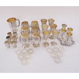 A collection of silver plated drinks goblets in four sizes together with twelve napkin rings and