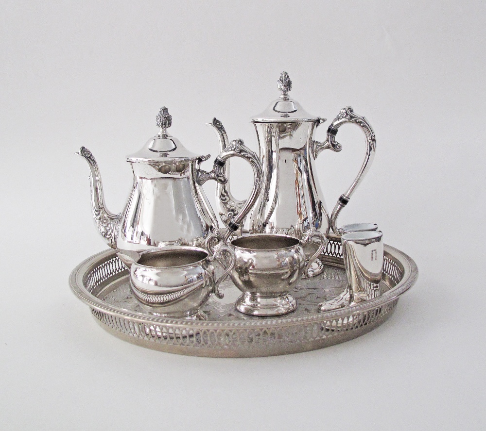 A silver plated tea set in a round pierced galleried tray W39cm, together with a pair of silver