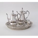 A silver plated tea set in a round pierced galleried tray W39cm, together with a pair of silver