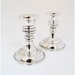 A pair of dwarf candlesticks, Egyptian silver Hallmarked 900