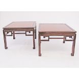 A pair of Chinese style carved mahogany low side tables