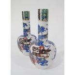 A pair of Japanese porcelain bottle vases, ribbed body, dragon decorated probably Arita