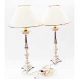 A pair of silver plated candle sticks converted to table lamps, the candlesticks