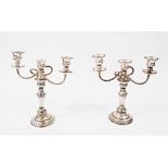 A pair of 20th Century silver plated three light candelabra