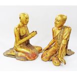 A pair of 20th century wooden gilded figures of praying Monks from Thailand