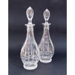 A pair of crystal decanters with stoppers