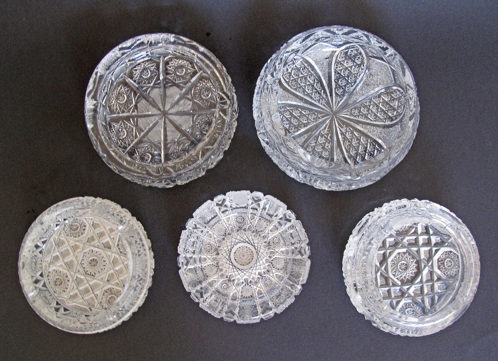 A collection of five Bohemian crystal hand cut ashtrays