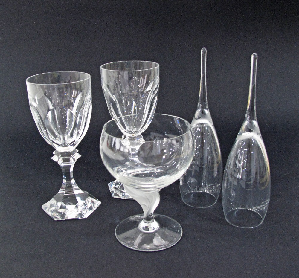 A collection of two St Louis wine glasses, a Lalique style glass and a pair of champagne flutes