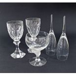 A collection of two St Louis wine glasses, a Lalique style glass and a pair of champagne flutes