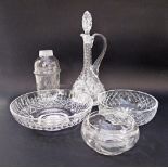 A collection of cut glass comprising three bowls, a bottle and a pitcher with stopper
