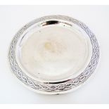 A Cypriot shallow dish engraved with a garland to the rim, Hallmarked silver 830 Stephanides & Son