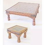 An Indian hardwood coffee table with metal and glass top