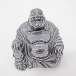 A Chinese carved obsidian figure of a happy Buddha