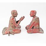 A pair of 20th century wooden red lacquered figures of praying Monks from Thailand