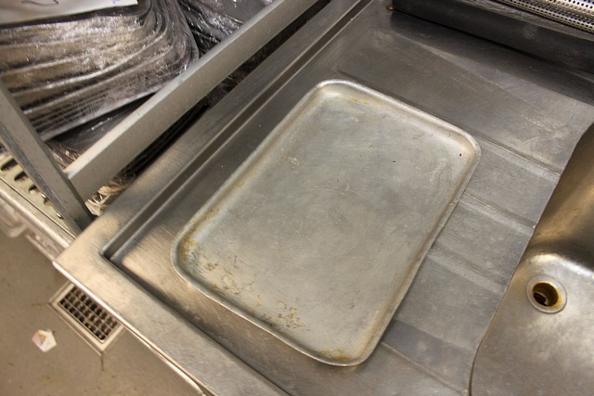 A large quantity f various baking pans as lotted