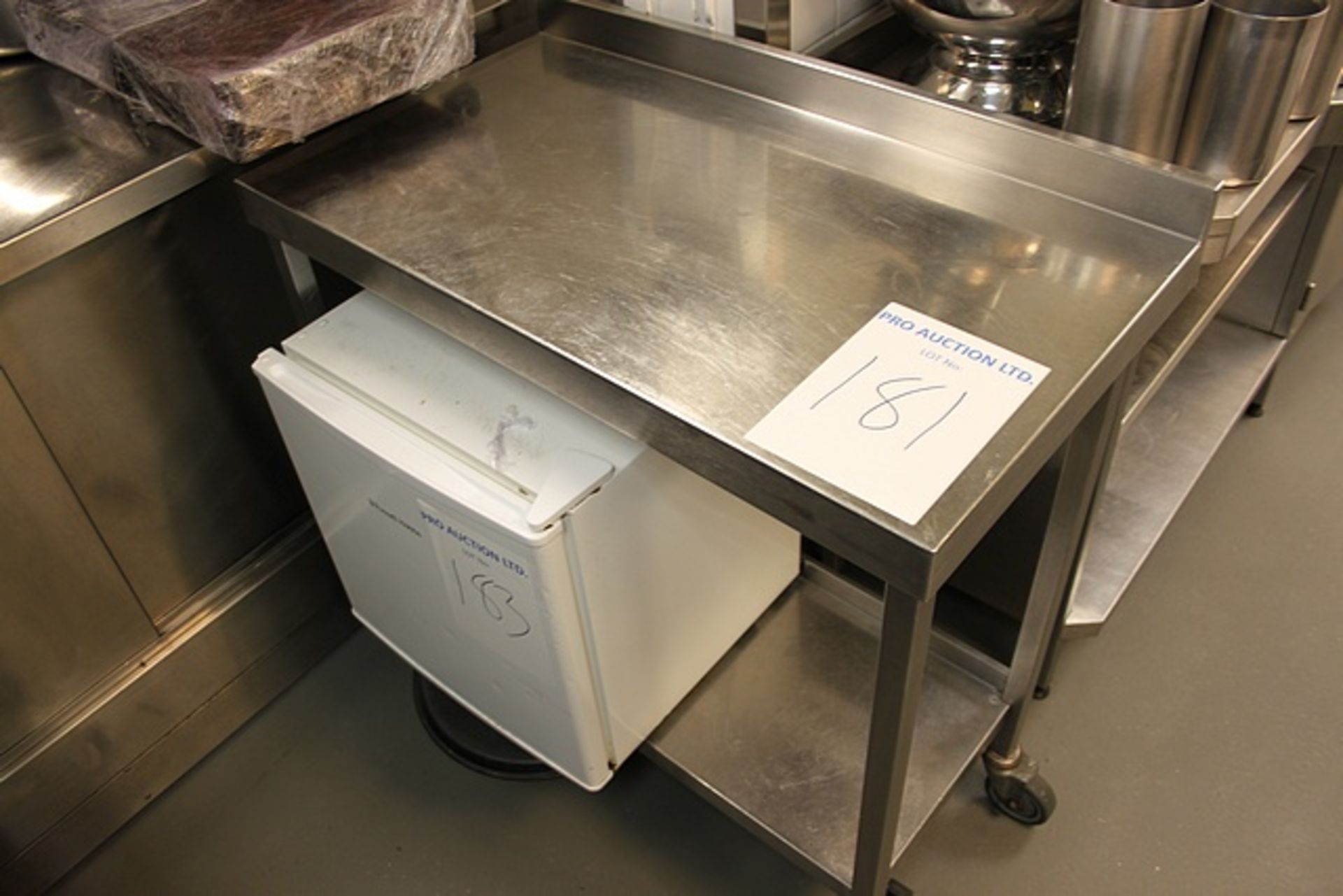 Stainless steel mobile table with shelf and upstand 950mm x 500mm