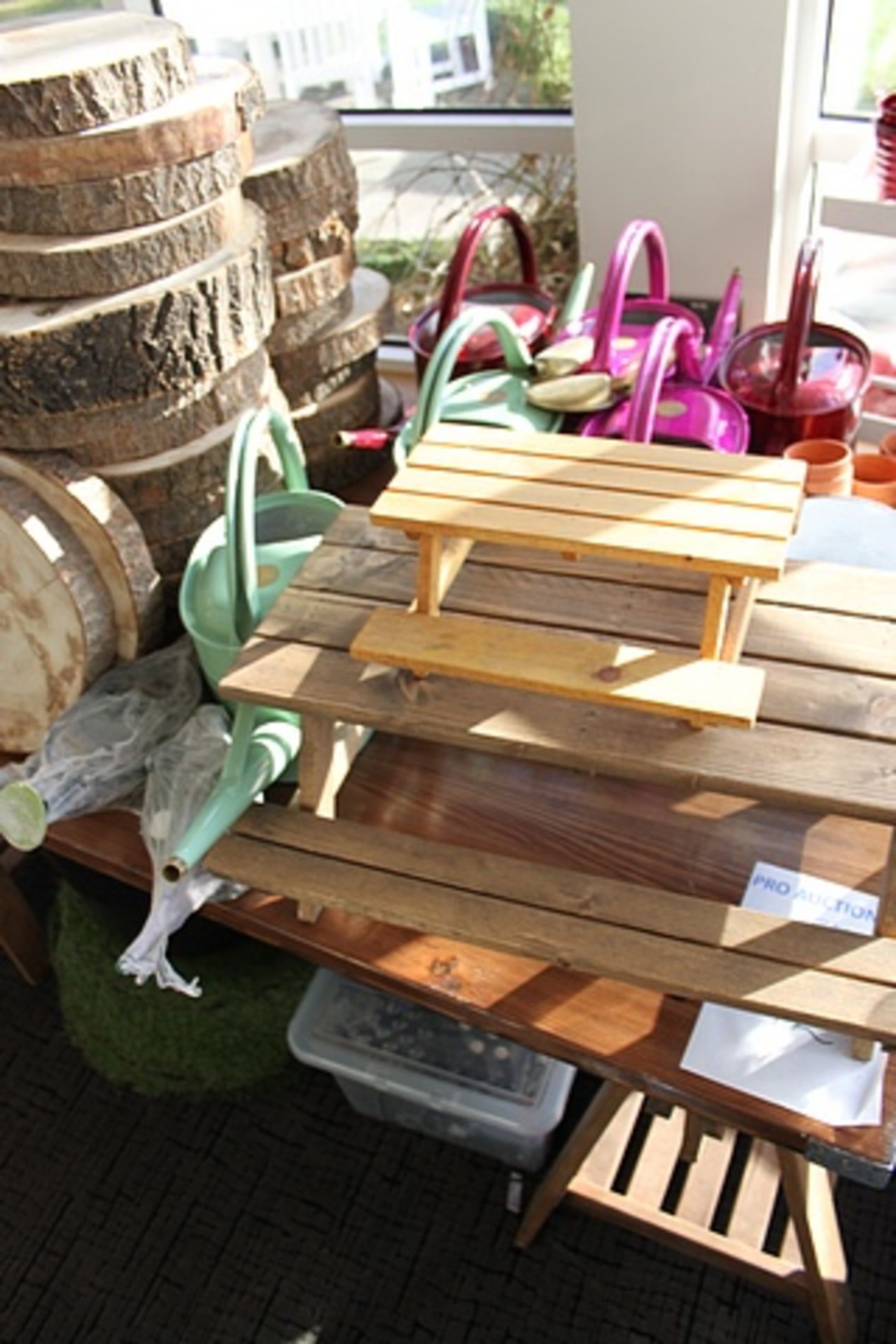 A large quantity decorative garden objet art comprising of watering cans, wooden wheelbarrows, - Image 2 of 4