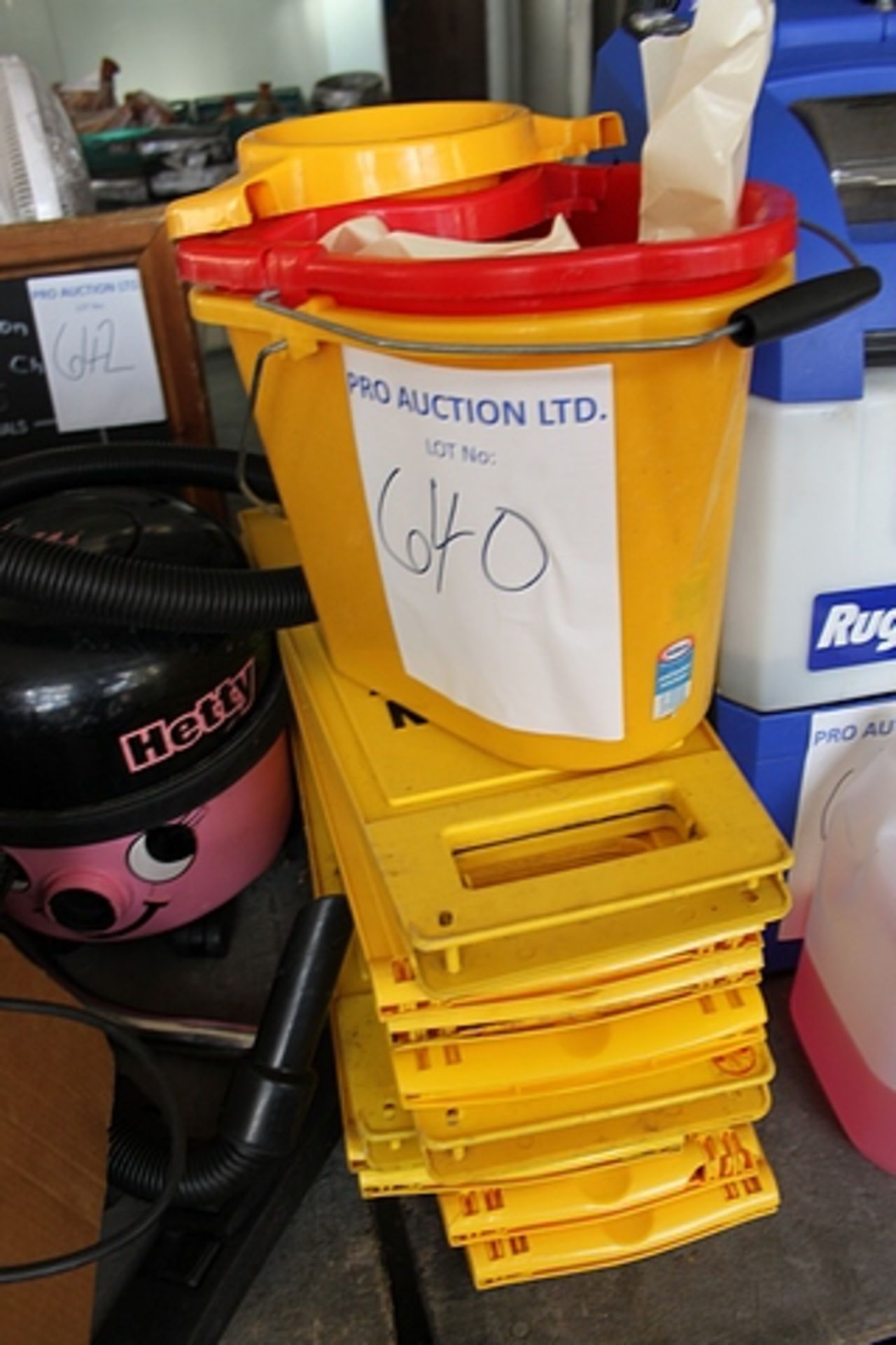 Various cleaning equipment - cautions sign, buckets mops, brushes etc.