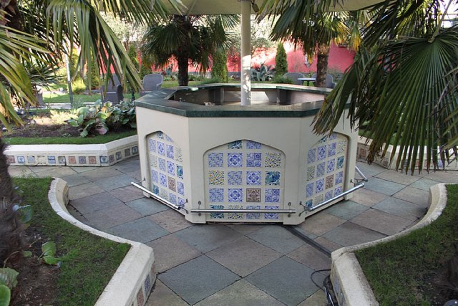 Octagonal bar structure painted wooded panels over a stainless steel back bar structure spans 2700mm