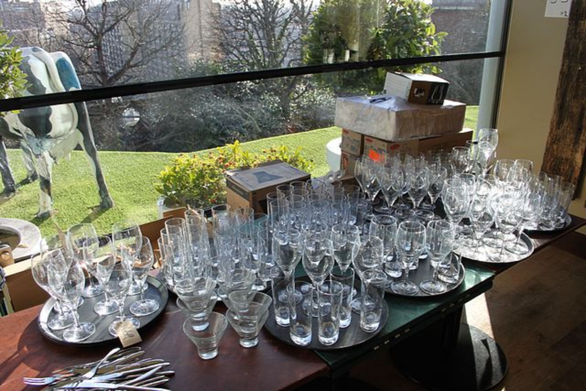 A large quantity of glassware as lotted comprising of wine glasses, cocktail glasses, tumblers and